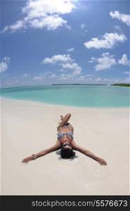 beautiful and happy young woman on beach have fun and relax on summer vacation over the crystal clear sea