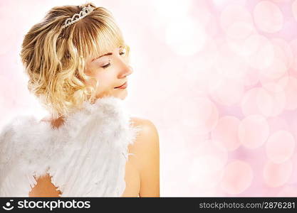 Beautiful angel over abstract pink background