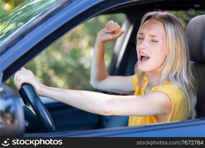 beautiful angry woman honking in her car