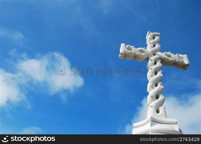 beautiful antique cross with sky background