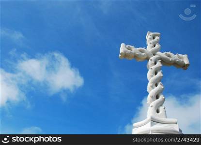 beautiful antique cross with sky background