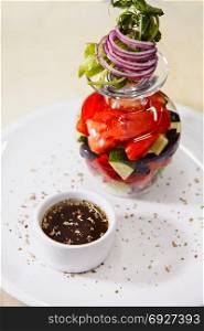 Beautiful, appetizing Greek salad of European cuisine. close-up