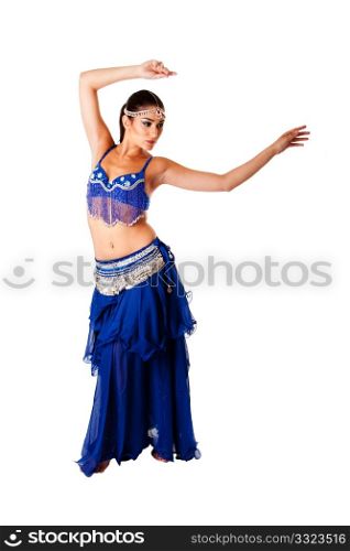 Beautiful Arabic belly dancer harem woman in blue with silver dress and head jewelry with gem dancing swirling her arms, isolated.