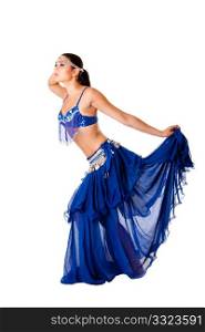 Beautiful Arabic belly dancer harem woman in blue with silver dress and head jewelry with gem dancing holding skirt, isolated.