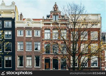 Beautiful Architecture Of Dutch Houses On Amsterdam Canal In Autumn