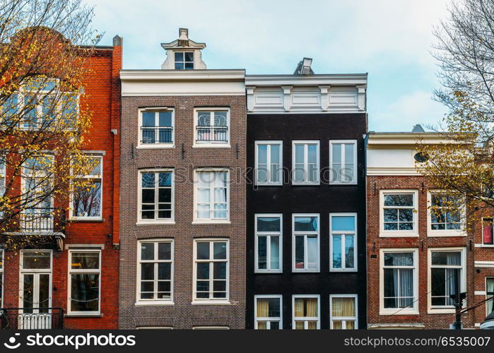 Beautiful Architecture Of Dutch Houses On Amsterdam Canal In Autumn