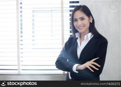 Beautiful Asian business women are smiling and working happy on office background