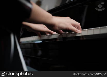 Beautiful asian girl learn to play piano