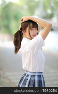 beautiful asian japanese school girl uniform looking at park outdoor