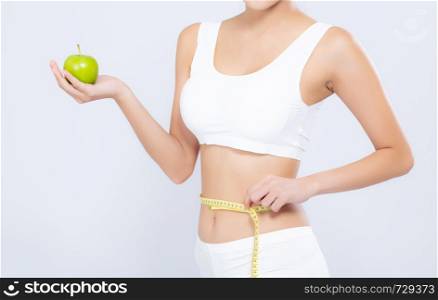 Beautiful asian woman diet and slim with measuring waist for weight and holding green apple fruit isolated on white background, girl have cellulite and calories loss with tape measure, health and wellness concept.