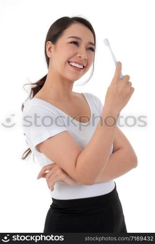 Beautiful Asian woman holding a toothbrush for brush teeth. Her is smile and teeth are white and beautiful and look hygiene. Concept for oral and dental care on the dentist advice