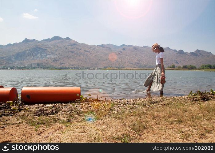 Beautiful asian woman traveling in nature. Summer vacation. Freedom concept