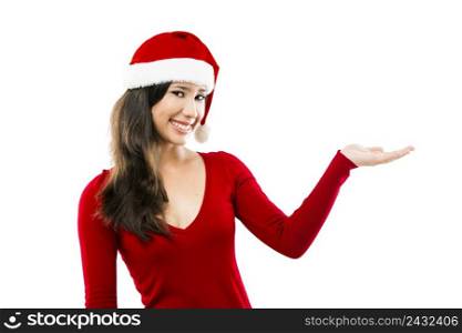 Beautiful asian woman wearing Santa’s hat and showing her right hand, isolated on white