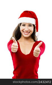 Beautiful asian woman wearing Santa’s hat with thumbs up, isolated on white