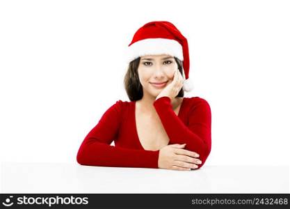 Beautiful asian woman with a beautiful smile wearing Santa’s hat,  isolated on white