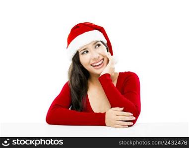 Beautiful asian woman with a beautiful smile wearing Santa’s hat,  isolated on white