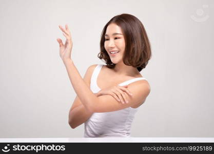 Beautiful Asian woman with short hair looking at camera smile with clean and fresh skin Happiness and cheerful with positive emotional,isolated on gray background,Beauty and Cosmetics Concept