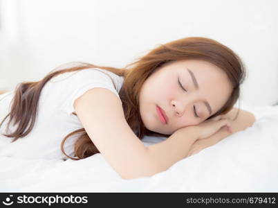 Beautiful asian young woman sleeping lying in bed with head on pillow comfortable and happy. girl with relax for health concept.