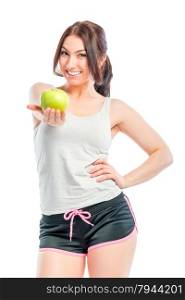 beautiful athlete holds a green apple