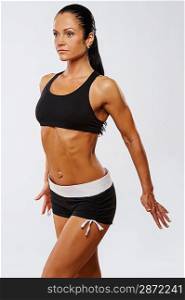Beautiful athlete woman doing fitness exercise.