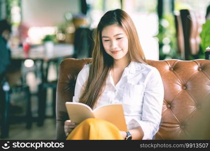 Beautiful Attractive Asian woman reading book for learn and education smile and positive thinking feeling so happiness and comfortable,Education Concept