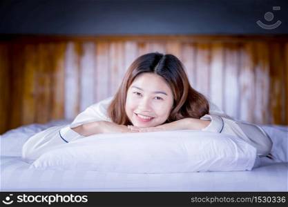 Beautiful Attractive Asian woman sleep and sweet dream on bed in bedroom in the morning feeling so relax and comfortable,Healthcare Concept