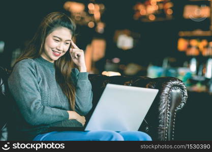 Beautiful Attractive Asian woman working with computer laptop and thinking to get ideas and requirement in Business startup feeling so happiness,Business Startup Concept