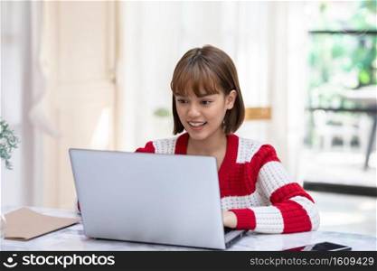 Beautiful Attractive Asian woman working with computer laptop and thinking to get ideas and requirement in Business startup feeling so happiness,Business Startup Concept