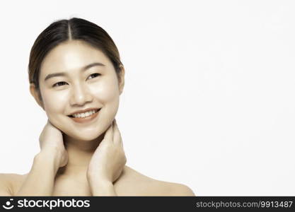 Beautiful Attractive Charming Asian young woman smile with white teeth and touching soft cheek feeling so happy and cheerful with healthy skin,isolated on white background,Beauty Cosmetology Concept