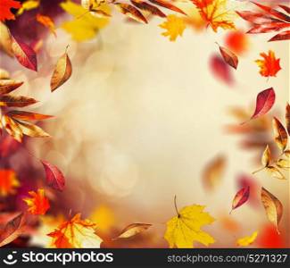 Beautiful autumn background with flying falling colorful leaves and bokeh , frame
