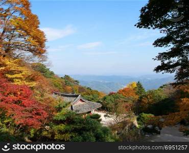 Beautiful autumn colors leaves surround Seokguram Grotto temple on mountain [UNESCO World Heritage], Gyeongju, South Korea.