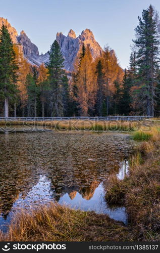 Beautiful autumn evening Lake Antorno and Three Peaks of Lavaredo (Lago Di Antorno and Tre Cime di Lavaredo), Dolomites, Italy. Picturesque traveling, seasonal and nature beauty concept scene.