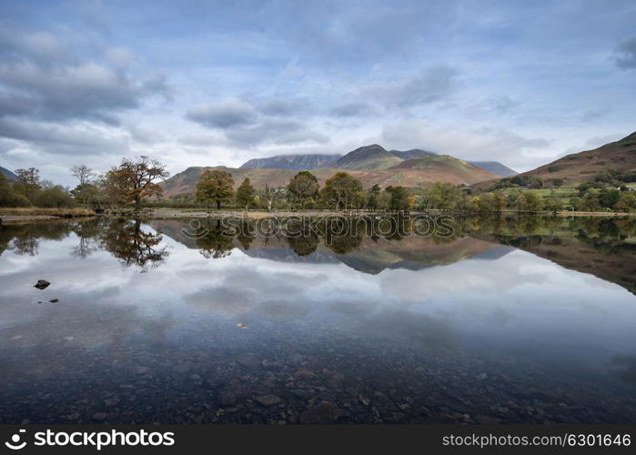 Beautiful Autumn Fall landscape image of Lake Buttermere in Lake District England