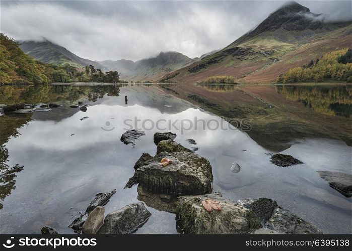 Beautiful Autumn Fall landscape image of Lake Buttermere in Lake District England