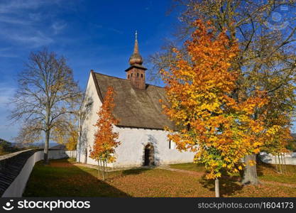 Beautiful autumn landscape with old Chapel of the Mother of God in Veveoi. Sunset and beautiful blue sky with clouds. Colorful nature background on autumn season. Brno - Czech Republic.