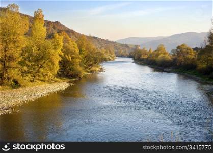 Beautiful autumn mountain river at sunset. Serbia