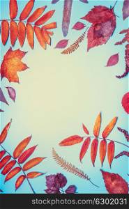 Beautiful autumn seasonal composing made with various colorful fall leaves on turquoise blue background, top view , frame