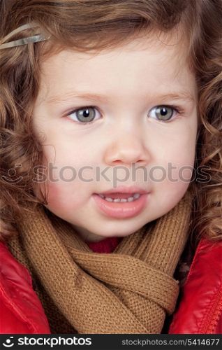 Beautiful baby girl with red coat isolated over white background