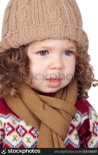Beautiful baby girl with wool cap isolated over white background