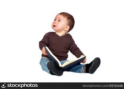 Beautiful baby with a book crying isolated on white background