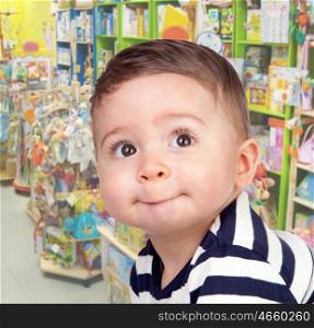 Beautiful baby with nice eyes in the toy store