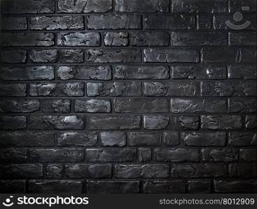 Beautiful background made of old black bricks