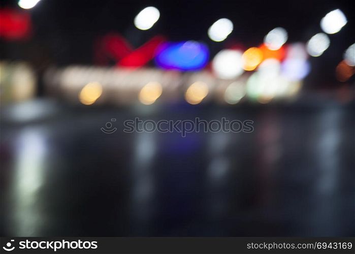 beautiful background of night lights, bokeh through wet glass