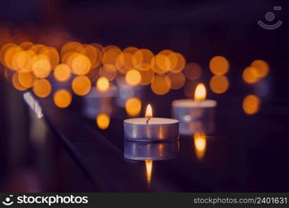 beautiful background with candles. Light in the dark