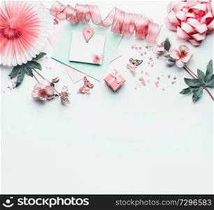 Beautiful background with greeting card mock up with pastel pink heart , flowers, party paper fan, ribbon and decoration, top view. Flat lay. Can using to Mothers day, wedding, birthday
