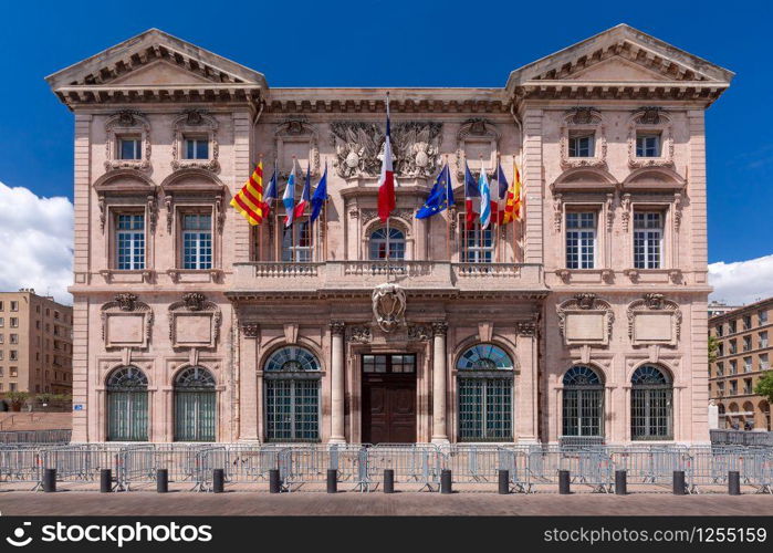 Beautiful baroque building of Marseille City Hall, Hotel de Ville, in old Vieux Port, Marseilles on sunny day, France. Old Port and Notre Dame, Marseille, France
