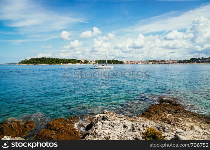 Beautiful bay near Rovinj, clear water and stony beach, Croatia