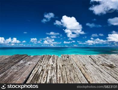 Beautiful beach and old wooden pier at Seychelles, La Digue
