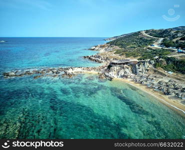 Beautiful beach and rocky coastline top aerial view drone shot, Sithonia, Greece