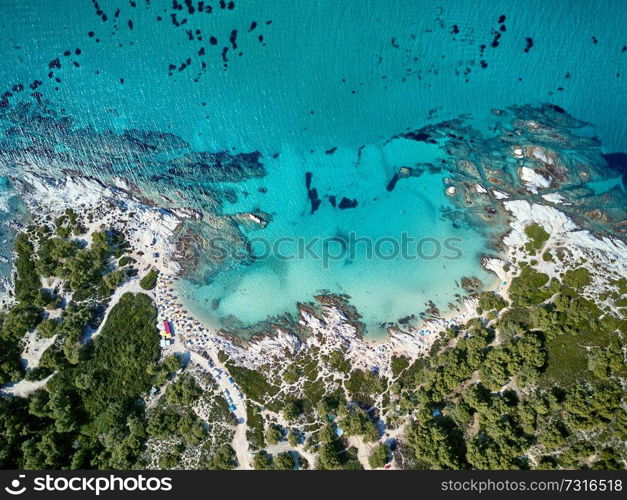 Beautiful beach and rocky coastline top aerial view drone shot, Sithonia, Greece